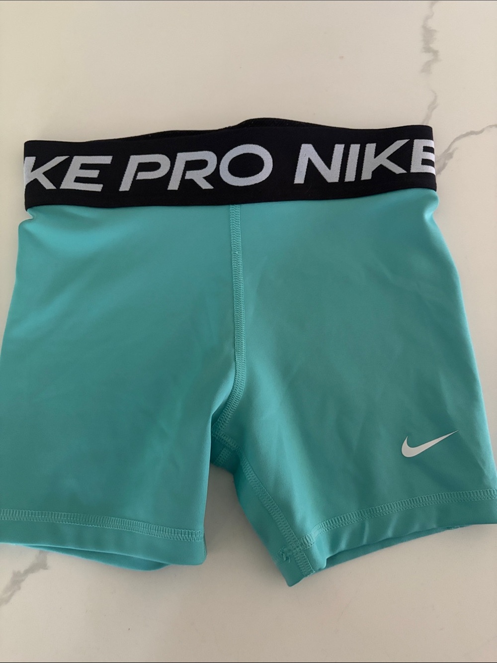 Nike Aqua/Turquoise Compression Shorts with Black Logo Waistband. Youth medium